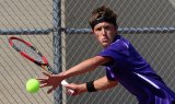 Spencer Denney has his eye on the ball in Wednesday's Division III tennis match final.